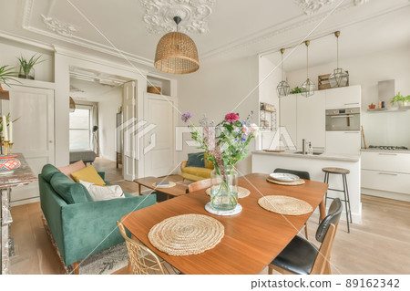 The rich interior of the living room of a modern house combined with a dining area kitchen 89162342