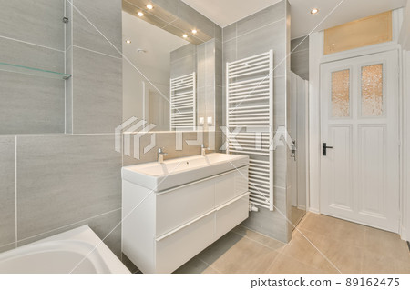 Bathroom in grey design with ceramic bathtub and sink and shower Bathroom in grey design with ceramic bathtub and sink and shower 89162475