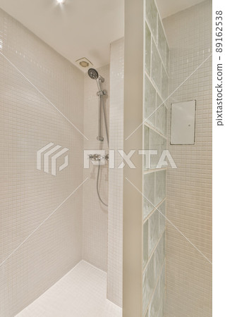 The interior of a bathroom in a cozy house with a toilet separated by a glass partition The interior of a bathroom in a cozy house with a toilet separated by a glass partition 89162538