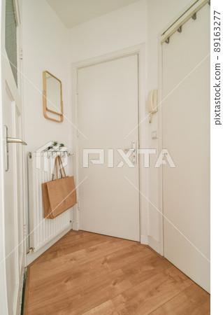 The entrance to the spacious apartment is through the corridor of a modern house 89163277