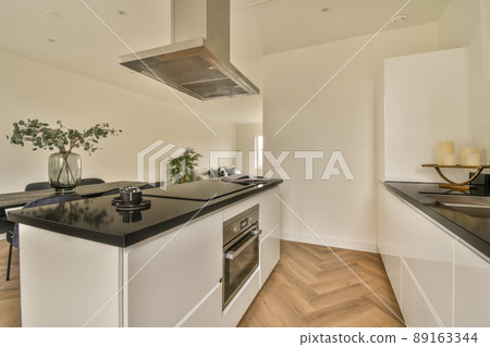 The interior of the kitchen and dining area in a modern style in a cozy apartment 89163344