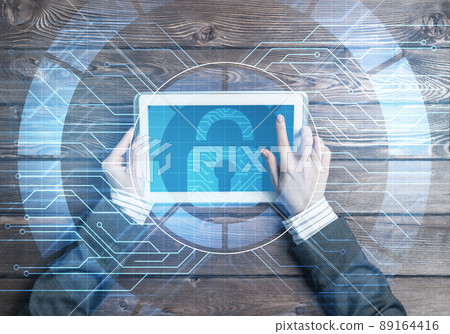 Concept of computer access with media lock icon on tablet screen Concept of computer access with media lock icon on tablet screen 89164416