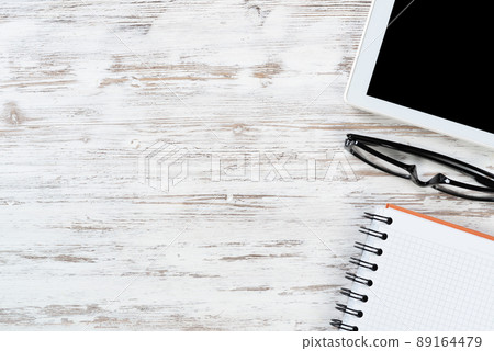 Still life of office workspace with supplies Still life of office workspace with supplies 89164479