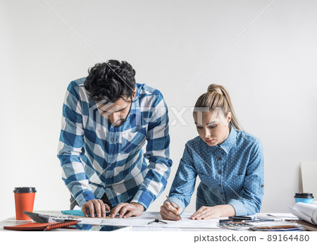 Man and woman together working at design project 89164480