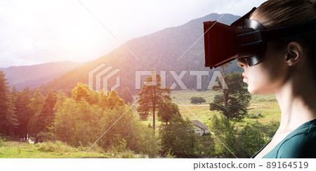 Young woman with VR glasses 89164519