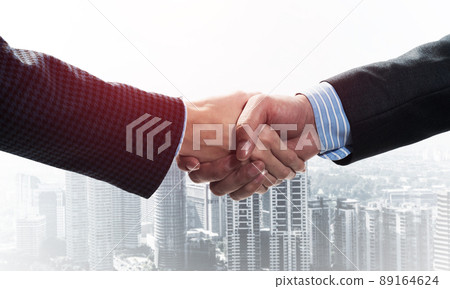 Close-up of the handshake of businessmen. 89164624