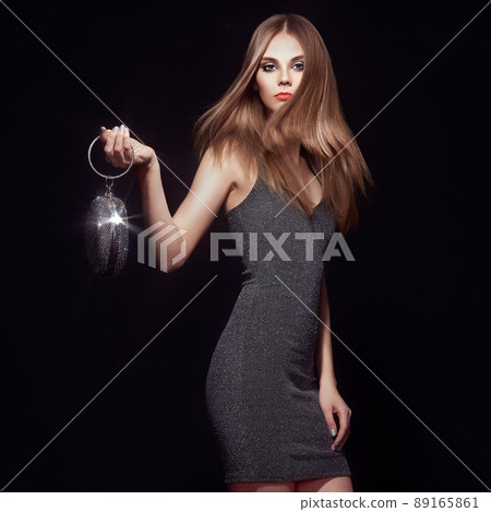 Blonde young woman in Little black dress Blonde young woman in Little black dress 89165861