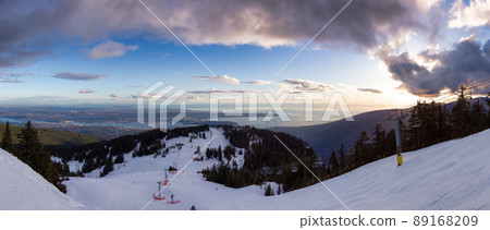 View of Top of Grouse Mountain Ski Resort with the City in the background. View of Top of Grouse Mountain Ski Resort with the City in the background. 89168209