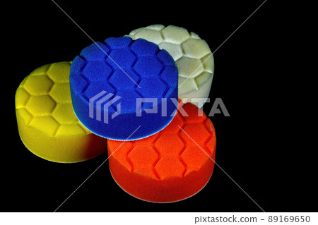 Foam Plastic Polishing Discs on a Black Background 89169650