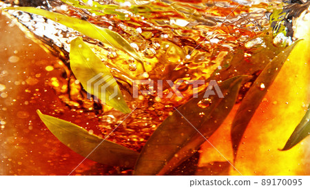 Detail of rotating tea leaves in water twister. Detail of rotating tea leaves in water twister. 89170095