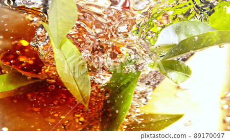 Detail of rotating tea leaves in water twister. Detail of rotating tea leaves in water twister. 89170097
