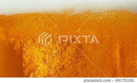 Macro photo of bubbling beer, closeup. 89170108