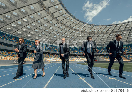 Group of business people participate in competition on race track Group of business people participate in competition on race track 89170496