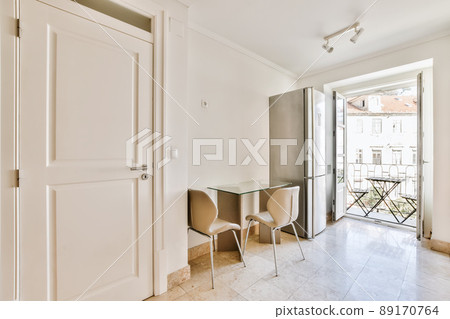 Luxury design of a room with a refrigerator and a table with two chairs Luxury design of a room with a refrigerator and a table with two chairs 89170764