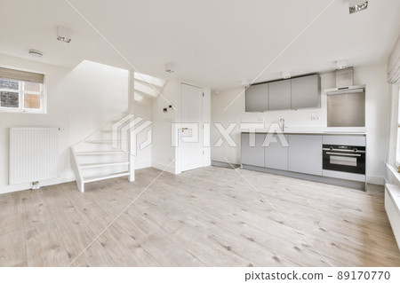 The interior of a cozy room with parquet floor and unfurnished The interior of a cozy room with parquet floor and unfurnished 89170770