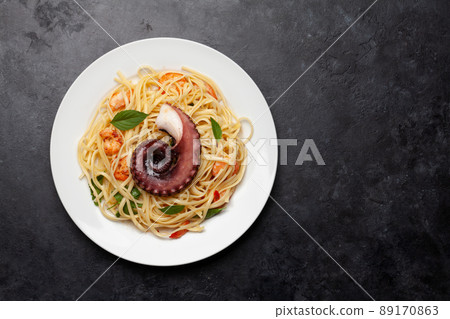 Seafood pasta with octopus and shrimps 89170863