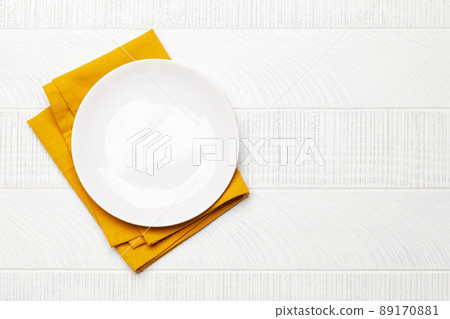 Empty plate over towel Empty plate over towel 89170881