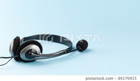 Headset over blue background Headset over blue background 89170915