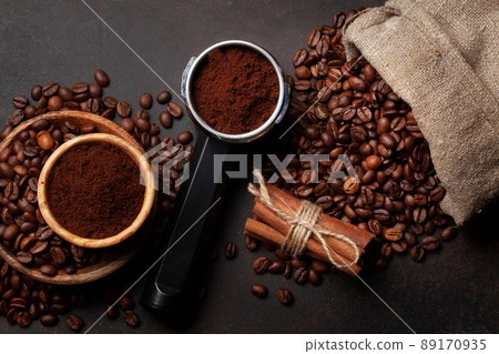 Roasted coffee beans and ground coffee in filter holder Roasted coffee beans and ground coffee in filter holder 89170935