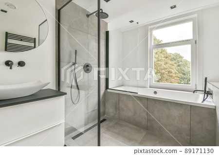 Luxury interior design of a bathroom with marble walls Luxury interior design of a bathroom with marble walls 89171130