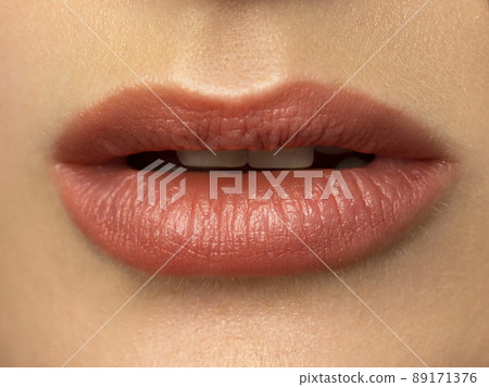 Closeup plump Lips. Lip Care, Augmentation, Fillers. Macro photo with Face detail. Natural shape with perfect contour. Close-up perfect natural lip makeup beautiful female mouth. Plump sexy full lips 89171376