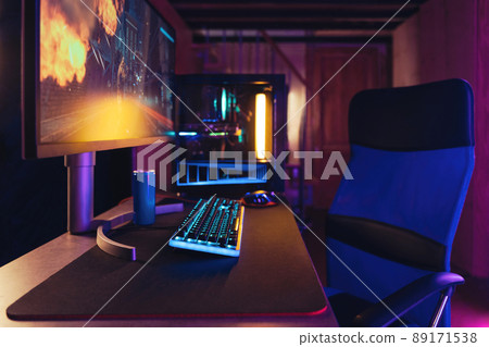 Professional gaming PC setup in neon room Professional gaming PC setup in neon room 89171538