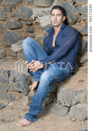 sexy man in a field wearing blue clothes - Stock Photo [89171840] - PIXTA