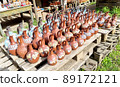 A counter with jugs and ceramic handicrafts made in the Georgian national style put up for sale 89172121