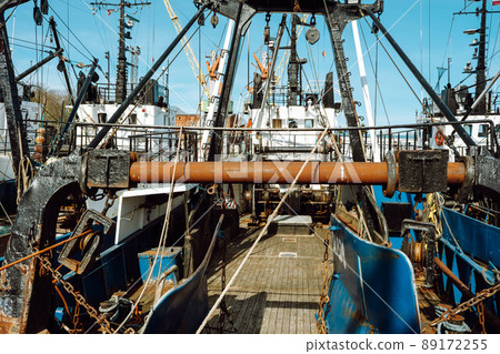 Fishing with a trawl. A large trawl with fish was dragged onto the deck of the ship. Fishing with a trawl. A large trawl with fish was dragged onto the deck of the ship. 89172255