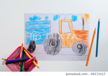 Drawing made by a child. Tractor with big wheels. Color pencils 89172417