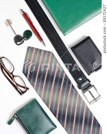 Men's accessories. Tie, green notebook, glasses, purse, business Men's accessories. Tie, green notebook, glasses, purse, business 89172427