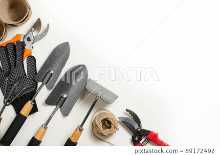 Garden tools and gloves on a white background. Space for text Garden tools and gloves on a white background. Space for text 89172492