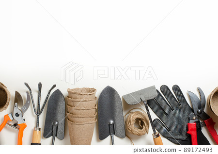 Garden tools and gloves on a white background. Space for text Garden tools and gloves on a white background. Space for text 89172493