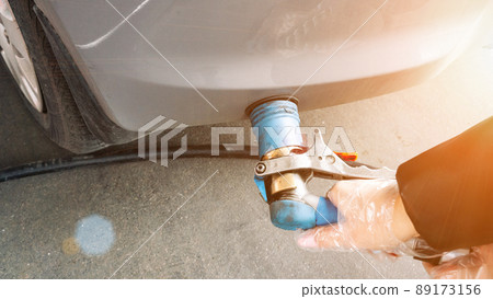 Filling car petrol. Pump gas fuel at gasoline oil station for nozzle tank. Black handle of the refueling gun. Filling car petrol. Pump gas fuel at gasoline oil station for nozzle tank. Black handle of the refueling gun. 89173156