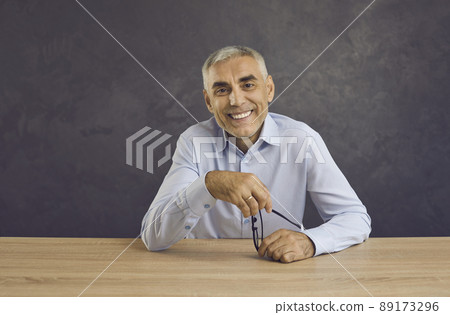 Happy man sit at desk speak on video call online 89173296