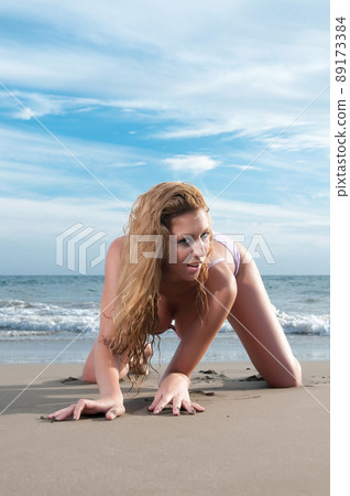 woman in bikini at the beach in spring or summer 89173384