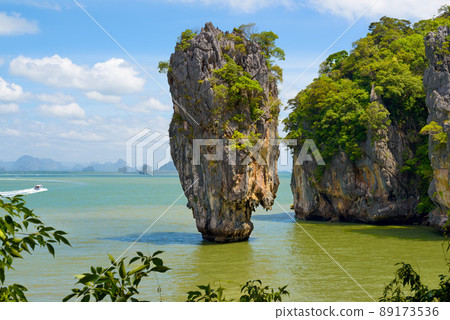 Landscape of amazing James Bond Island and Ko Tapu rock, tropical sea beach near Phuket, Phang Nga Bay, Thailand. Photo from attraction day tour, one-day trip from Krabi province southern Thailand. Landscape of amazing James Bond Island and Ko Tapu rock, tropical sea beach near Phuket, Phang Nga Bay, Thailand. Photo from attraction day tour, one-day trip from Krabi province southern Thailand. 89173536