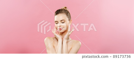 Beauty Concept - Beautiful Woman with Clean Fresh Skin close up on pink studio. Skin care face. Cosmetology. 89173736