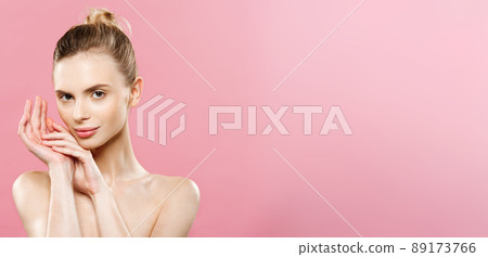 Beauty Concept - Beautiful Caucasian woman with clean skin, natural make-up isolated on bright pink background with copy space. 89173766