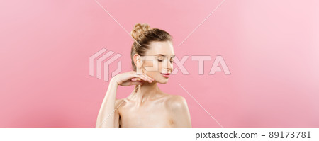 Beauty Concept - Beautiful Caucasian woman with clean skin, natural make-up isolated on bright pink background with copy space. 89173781