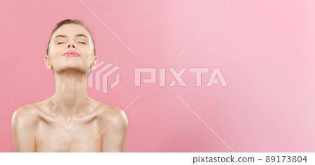 Beauty Concept - Beautiful Woman with Clean Fresh Skin close up on pink studio. Skin care face. Cosmetology. 89173804