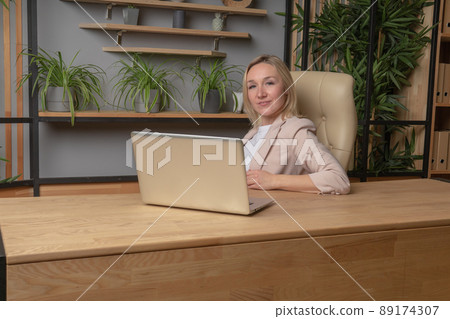 The girl at the computer business lady, the concept of a torgitologist gender equality job shopping freelance desktop online, from work laptop in using and adult internet, concept notebook. Tablet 89174307