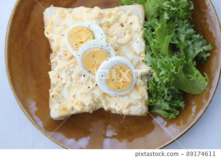 Open sandwich with lots of egg on top 89174611