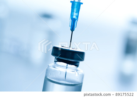 Medical syringe with a needle and a bollte with vaccine. 89175522