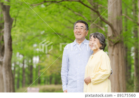 Senior couple smiling in the fresh green Senior couple smiling in the fresh green 89175560