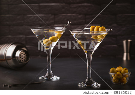 Martini cocktail on dark stone table. 89185032