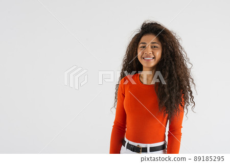 Young woman standing looking at camera with copy space 89185295