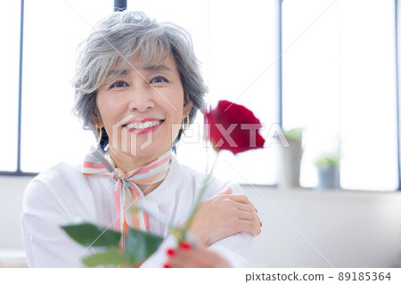 Senior woman portrait of a gray-haired woman Senior woman portrait of a gray-haired woman 89185364