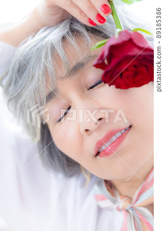 Senior woman portrait of a gray-haired woman Senior woman portrait of a gray-haired woman 89185386