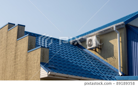 detail of roof of the house against blue sky detail of roof of the house against blue sky 89189358